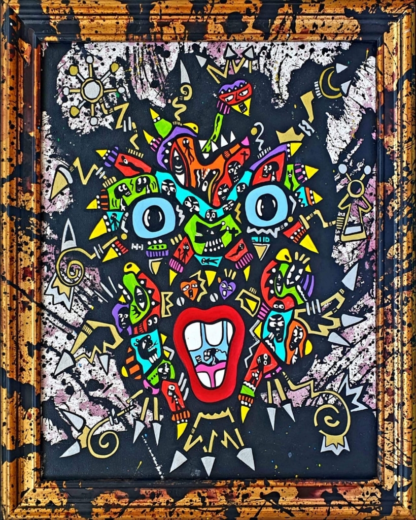 Seul de Jean-Marc Calvet, acrylique sur toile originale représentant un visage solitaire aux grands yeux bleus et à la bouche rouge, composé de multiples personnages et symboles colorés. Encadrée d'un cadre doré éclaboussé de peinture noire, l'œuvre mêle humour, introspection et énergie expressive dans l'univers singulier de l'artiste.