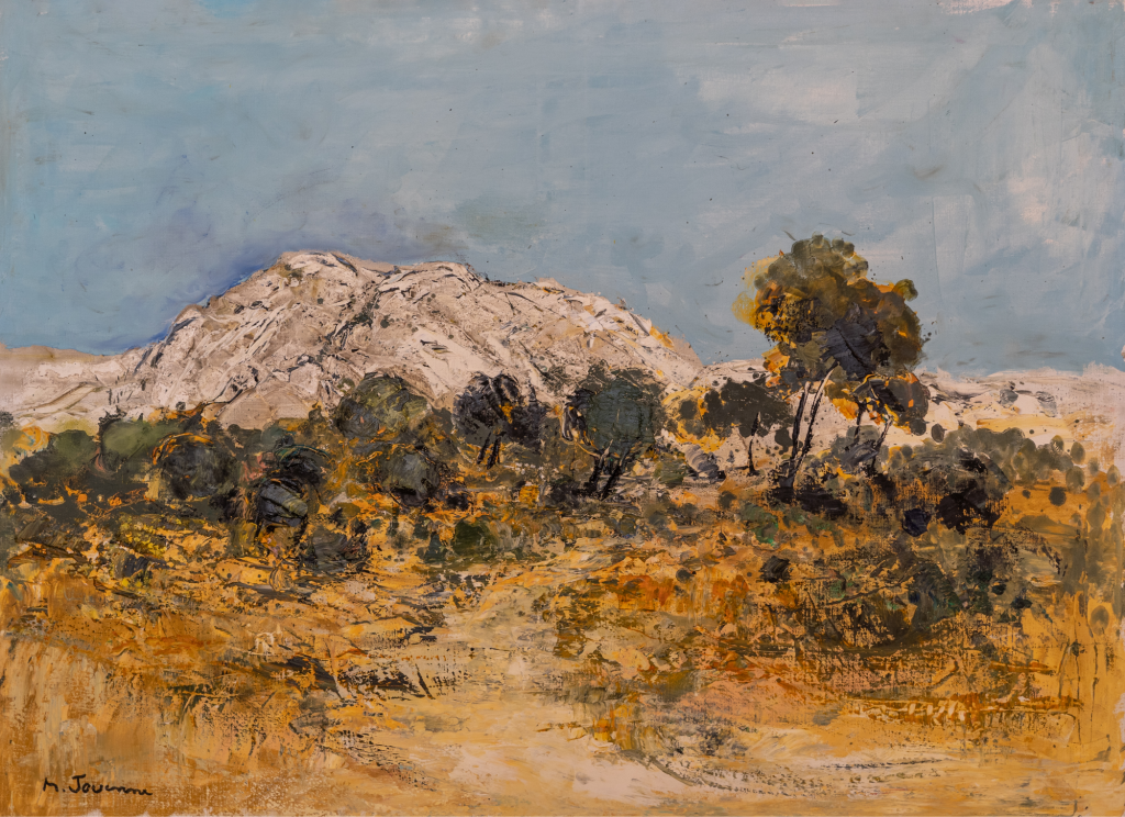 Peinture en huile sur toile intitulée PAYSAGE DES ALPILLES de Michel JOUENNE, cette composition figurative est la représentation d'un chemin en Provence avec des vignes, une terre sèche et un massif montagneux dans le fond